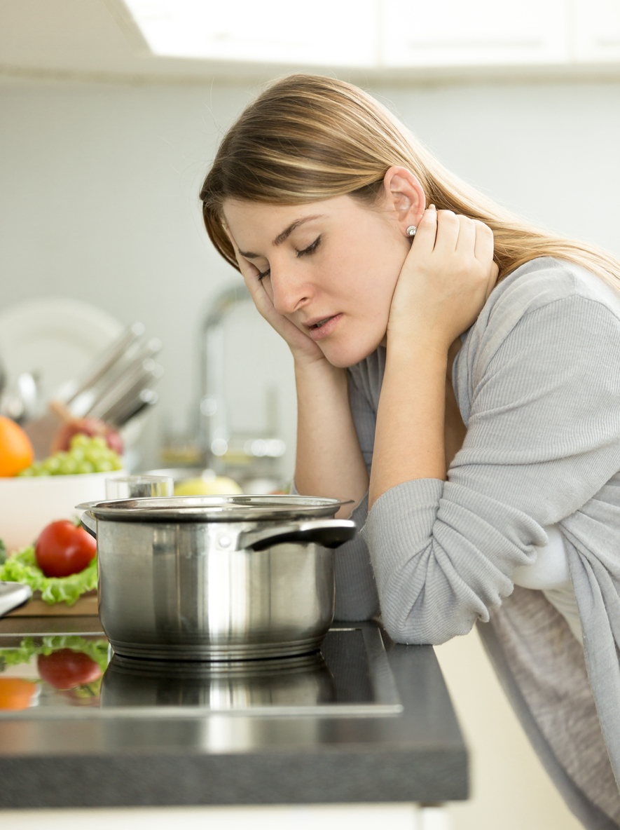 Woman Leaning on Stove